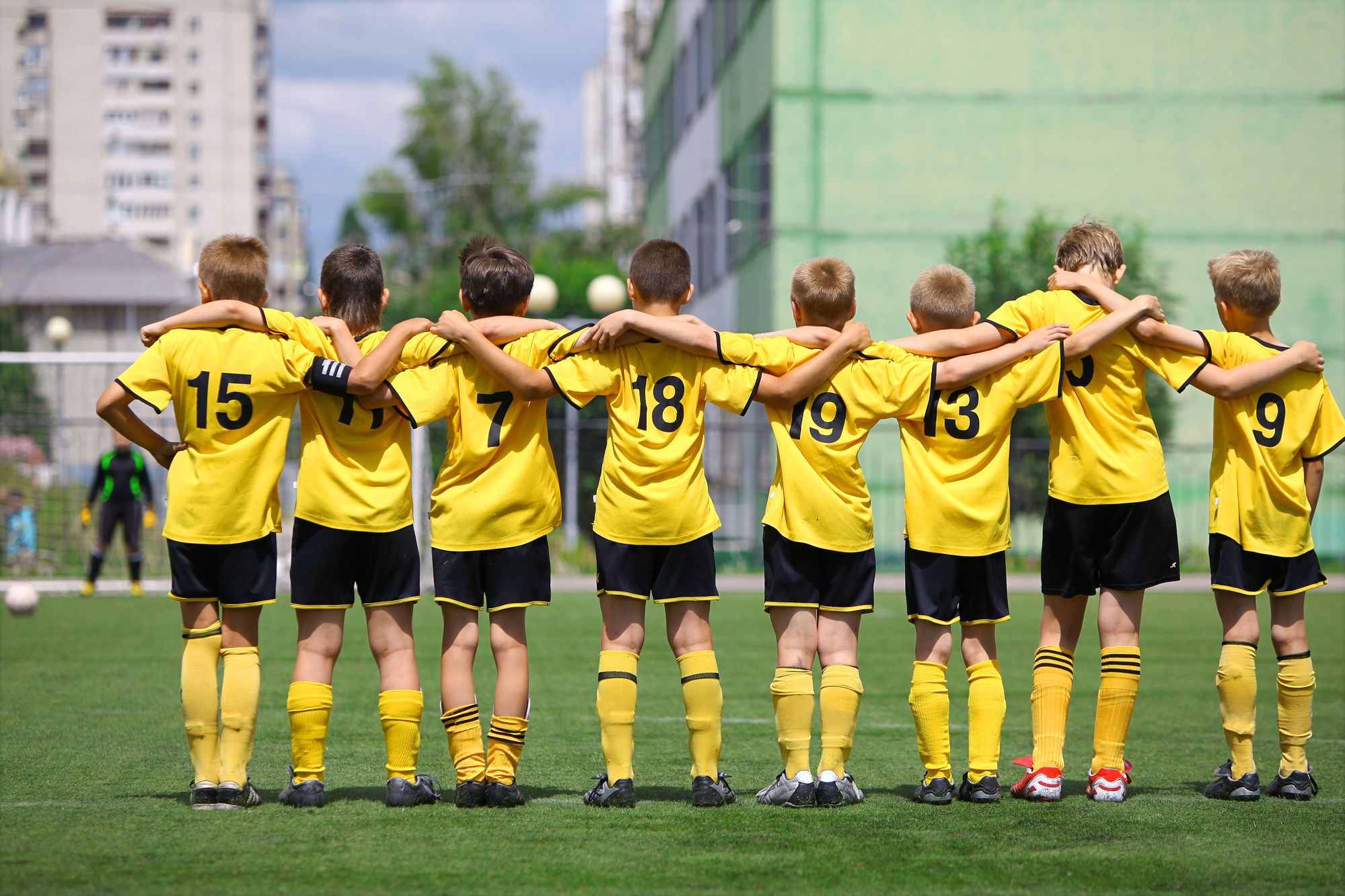 boys soccer team in clean yellow and black uniforms